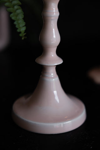 Close-up shot of the base of the Pink Enamel Cast Style Candlestick Holder.