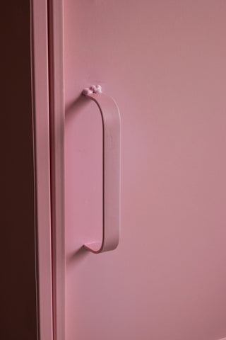 Close-up of the handle on the door of the Pink Industrial-Style Bedside Table.