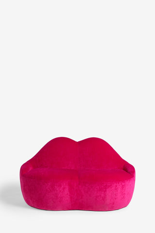 The Pink Lips Sofa on a white background, seen from the front.