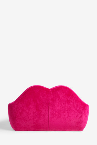 The Pink Lips Sofa on a white background, seen from the back.