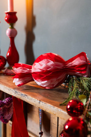 Image of the Set Of 3 Pink & Red Honeycomb Sweets on a wooden surface.