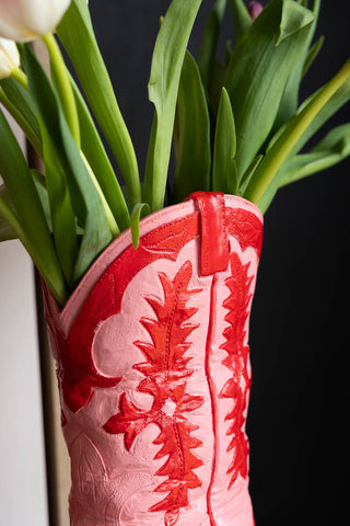 Close-up of the top of the Pink & Red Cowboy Boot Vase, styled with flowers inside.