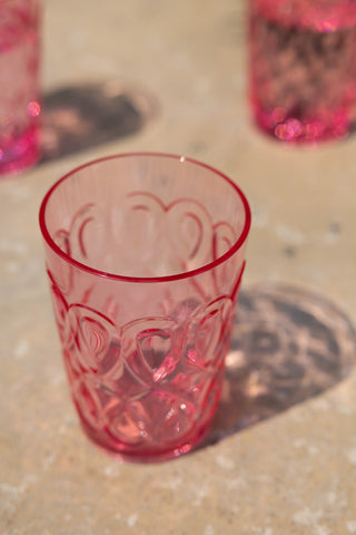 A detailed shot of the Pretty Embossed Pink Water Tumbler showing the colour of the rim