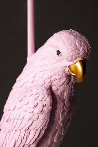 Close-up of the face of the parrot on the Pretty Pink Parrot Floor Lamp with Shade.