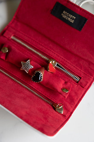 Close-up of the inside of the Queen of Hearts Playing Card Jewellery Case styled with jewellery inside.