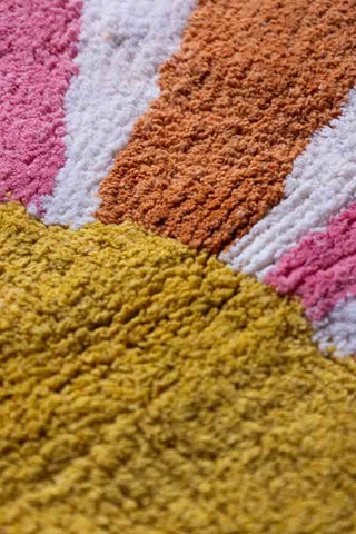 Close-up shot of the Ray of Sunshine Tufted Cotton Bath Mat.