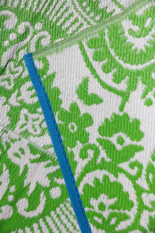 Detail shot of the Recycled Vintage Design Outdoor Rug in Green.