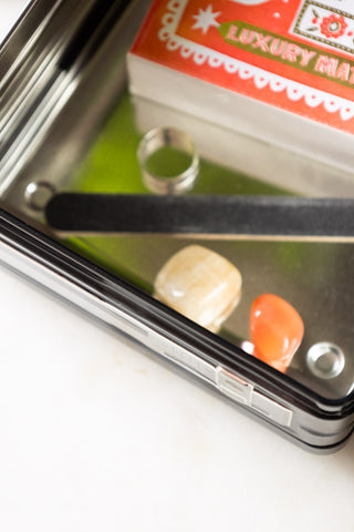 Close-up of the Retro Cassette Recorder Storage Tin with the lid off, with various small accessories styled inside.