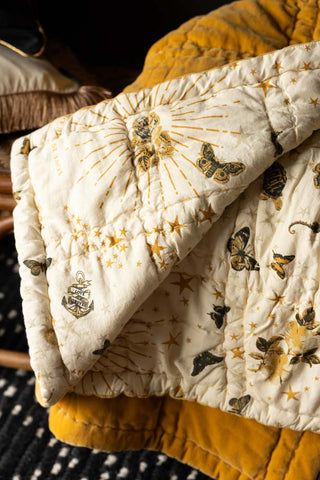 Close-up of the print on the Reversible Gold Rock & Rose Throw.