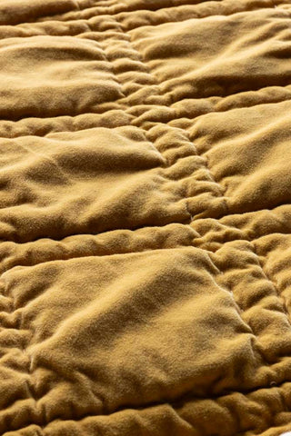 Close-up of the fabric of the Reversible Gold Rock & Rose Throw.