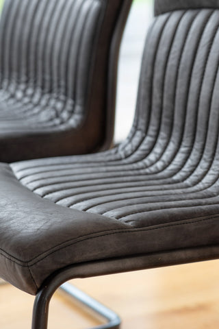 Detail shot of the Ribbed Antique-Style Black Leather Chair.