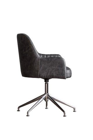 Cutout of the Ribbed Antique-Style Black Leather Swivel Chair seen from the side, on a white background.