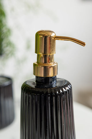 Detail shot of the pump on the Ribbed Black Glass & Gold Effect Soap Dispenser.