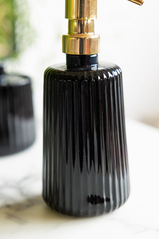 Close-up of the Ribbed Black Glass & Gold Effect Soap Dispenser.