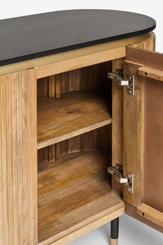 Close-up of the Ribbed Sideboard on a white background with one of the doors open.