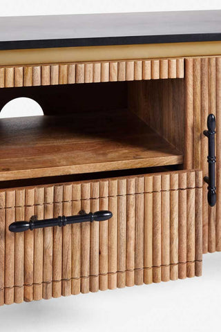 Close-up of the Ribbed TV Unit with the drawer slightly open, on a white background.