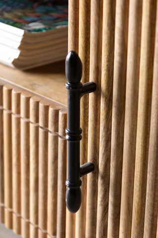 Close-up of a cupboard handle on the Ribbed TV Unit.