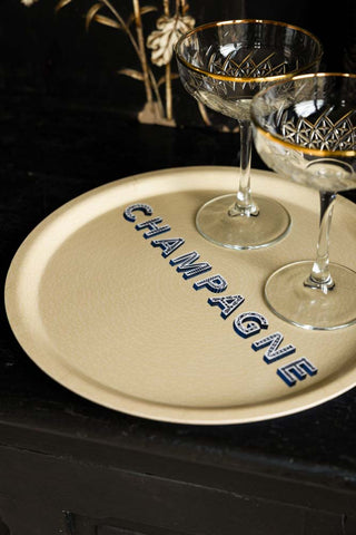 The Round Champagne Tray displayed with cocktail glass,