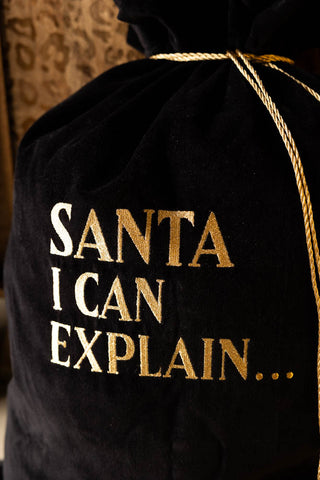 Close-up of the text and the cord on the Santa I Can Explain Velvet Christmas Sack.