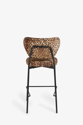 One of the Set Of 2 Bar Stools in Leopard Print Velvet seen from the back, on a white background.