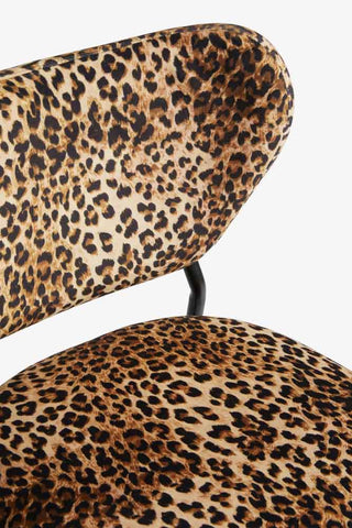 Close-up of the back/seat of one of the Set Of 2 Bar Stools in Leopard Print Velvet, on a white background.