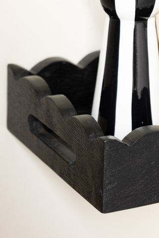 Detail shot of the corner of one of the Set Of 2 Black Wooden Scalloped Wall Shelves.