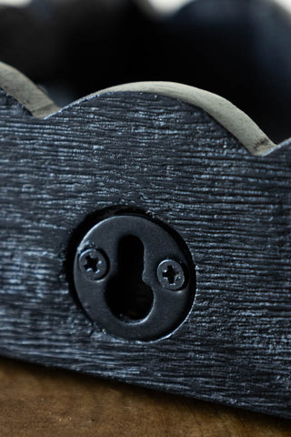 Close-up of the fixing on the Set Of 2 Black Wooden Scalloped Wall Shelves.