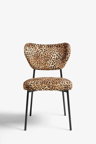 A leopard print dining chair on a plain background.