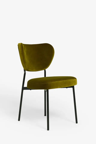 One of the Set Of 2 Dining Chairs In Needlecord Velvet Green, seen from a side angle, in front of a white background.