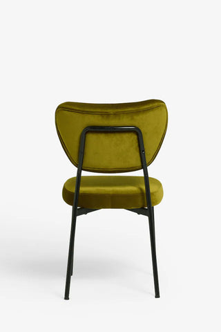 One of the Set Of 2 Dining Chairs In Needlecord Velvet Green seen from the back, in front of a white background.