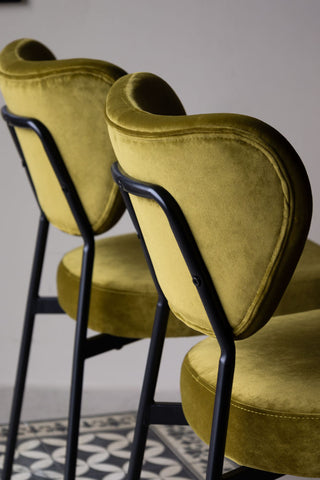 Close-up of the Set Of 2 Dining Chairs In Needlecord Velvet Green seen from the side/back.