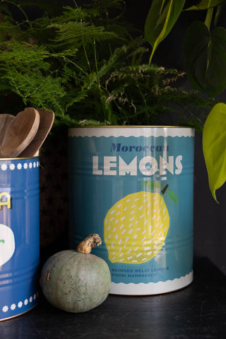 A close up image of The Set Of 2 Lemon & Harissa Storage Tins - Large showing the lemon tin