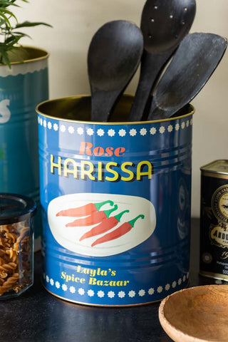 One of the Set Of 2 Lemon & Harissa Storage Tins - Large displayed with utensils inside.