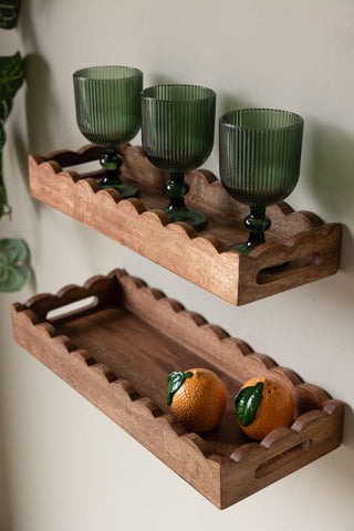 The Set Of 2 Natural Wooden Scalloped Wall Shelves styled on a light wall with various kitchen accessories on.