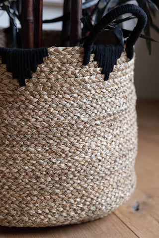 Detail shot of the side of one of the Set Of 2 Seagrass Baskets.