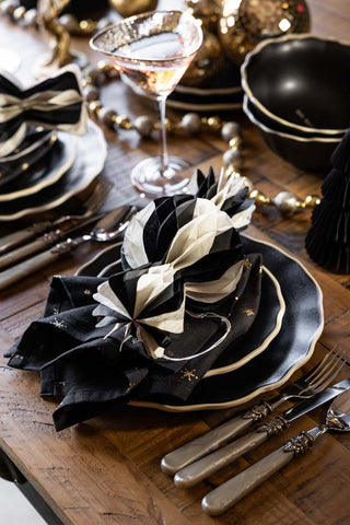 One of the Set Of 3 Black & White Honeycomb Sweets styled as part of a Christmas table setting on a decorated table.