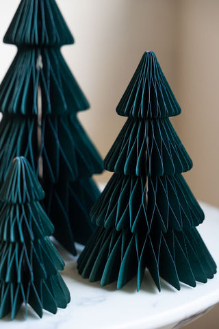 A close up image of the medium tree in the Set Of 3 Dark Green Honeycomb Christmas Trees showing the large and small in the background