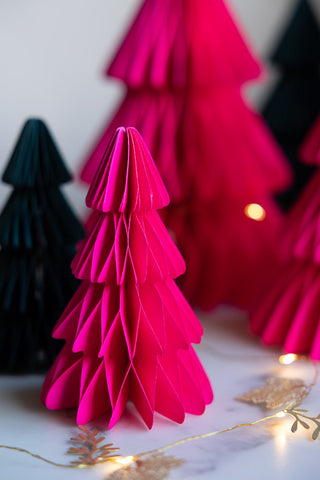 A detail of the small tree in the Set Of 3 Neon Pink Paper Trees 