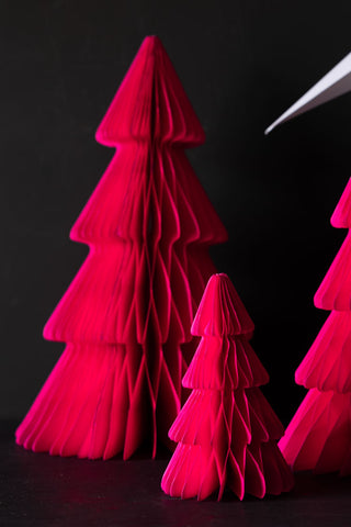 The Set Of 3 Neon Pink Paper Trees styled on a dark surface.