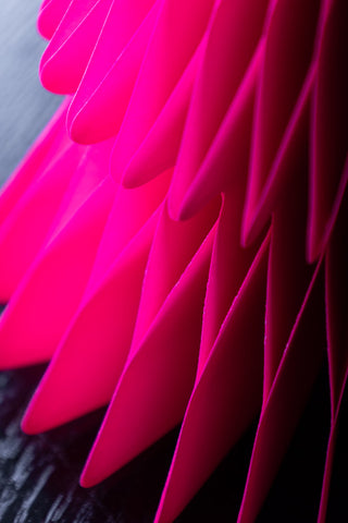 Detail shot of the base of one of the Set Of 3 Neon Pink Paper Trees.