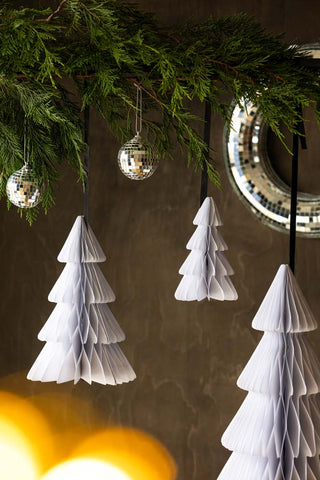 Set Of 3 White Honeycomb Christmas Trees hanging from up and over with greenery