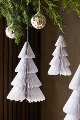 Set Of 3 White Honeycomb Christmas Trees hanging from up and over with greenery and disco balls