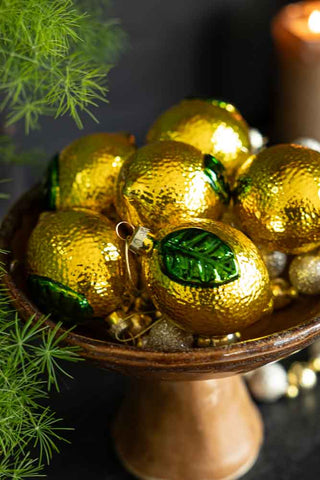 Close-up of beautiful yellow lemon decorations in a bowl.