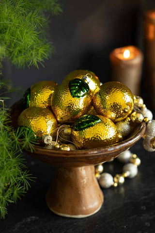 yellow christmas tree decorations in a rustic bowl - set of 6 pictured.