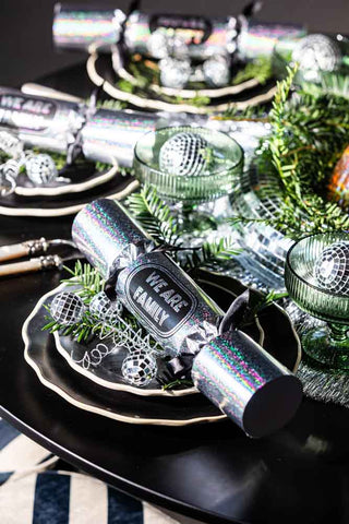 The Set Of 6 Silver Disco Christmas Crackers shown on a table setting with a silver and green colour scheme.