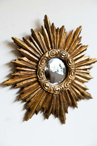 One of the Set Of 9 Assorted Ornate Gold Framed Mirrors on a white wall.