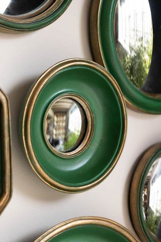 Some of the Set of 12 Antique Green & Gold Convex Framed Mirrors displayed on a neutral wall.