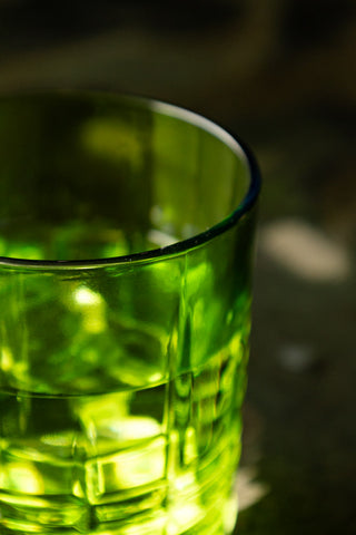 Close-up of the rim on one of the Set of 2 Green Whiskey Embossed Glasses.