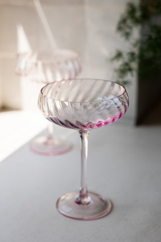 Shot focused on one of the Set of 2 Scalloped Coupe Cocktail Glasses, with the other displayed in the background.