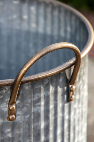 Close-up of the top/handle of one of the Set of 3 Industrial Style Iron Planters.